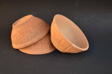 A closeup view of Set of eco friendly Sustainable Earthen Pots or Bowls to serve food or Snacks.
