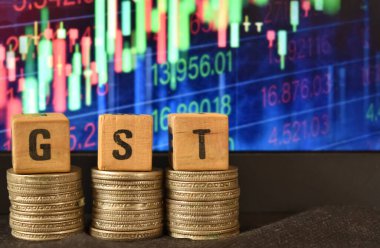 Sharemarket dokusunun arka planına karşılık GST harflerinin yakın plan seçici odak resmi