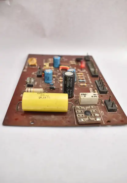 stock image A closeup picture of electronic circuit board with semi conductors, resistors and capacitors.