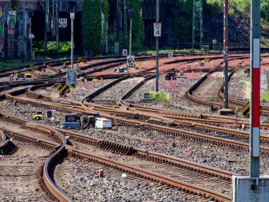 railroad tracks near central station in hagen, Germany, view on switches clipart