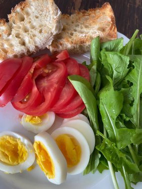 sandwich with ham, eggs and cheese