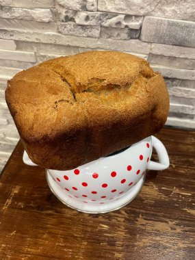 freshly cooked coffee and cup of bread and bun on the table, top view, close-up