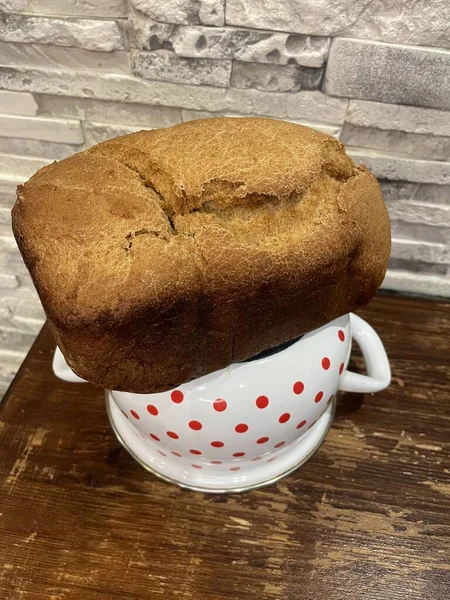 freshly cooked coffee and cup of bread and bun on the table, top view, close-up