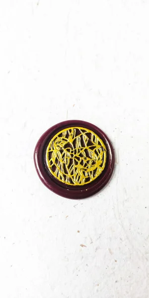 wax seal stamp on white paper background. Top view. Copy space.