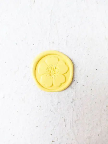 wax seal stamp on white paper background. Top view. Copy space.