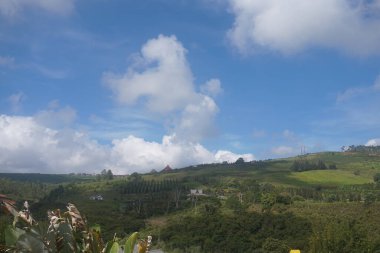 Mountain landscape with blue sky and white clouds in Indonesia