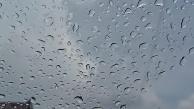 rain drops on the window glass. rain drops on a window. water drops on glass.