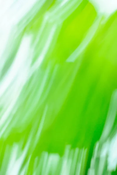 Natural green long time exposure motion blur. Natural green art blurred bokeh background with motion effect.