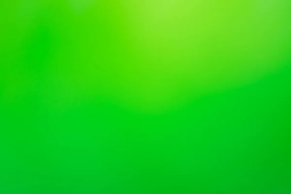 Green blurred colored abstract background. Green defocused bokeh background intentionally blurred editing