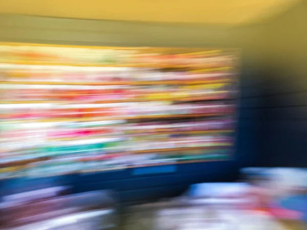 Seed company supplier of seeds blur defocus image. Blurred motion background of various seed bags for amateur gardeners