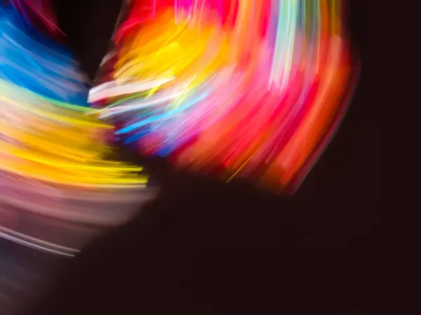 Blurred colored abstract smooth transitions of iridescent  neon colors on black