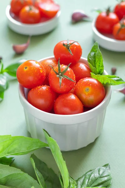 White Bowl Fresh Red Cherry Tomatoes Green Basil Green Background — Stock Photo, Image