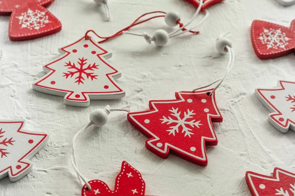 stock image Red and white wooden Christmas toys on a white background. Wooden Christmas tree toys.