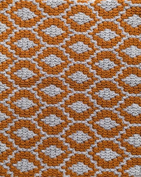 オレンジグレーのモザイクかぎ針編みの質感 楕円形の繰り返しパターン 編まれた背景 — ストック写真