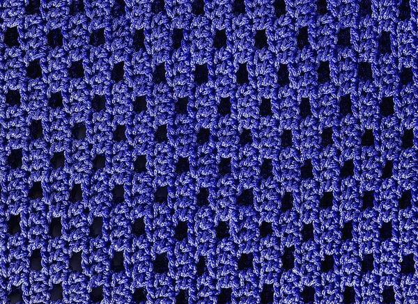 Blue crochet pattern. Simple knitting mesh pattern. String knitted background.