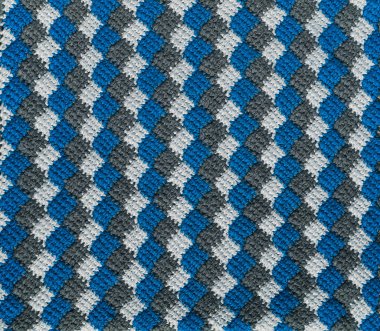 Mavi beyaz gri örgü arka plan. Tığ işi tunisein entrelac.