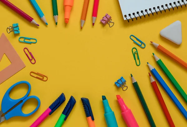 stock image Frame from school supplies on a yellow background. Top view. Copy space.