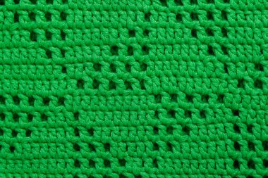 Üçgen desenli örgülü yeşil örgü kumaş. Örgü arkaplan.