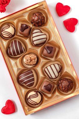 Delisious chocolate pralines and red heart for Valentine's Day.