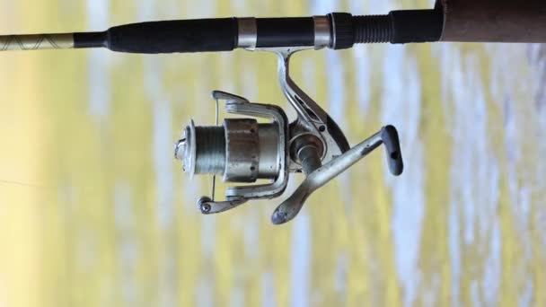 Vertical Video Slow Motion Close Fishing Rod Reel Spinning Water