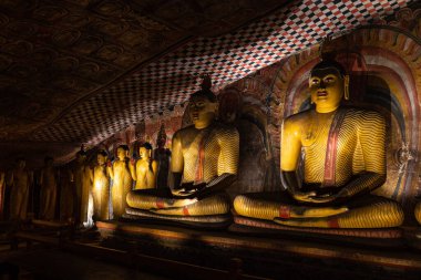 Buddha statues at temple in Dambulli Sri Lanka