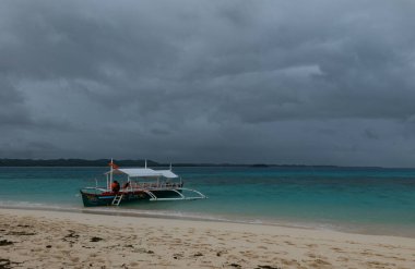 Catamarans on the beach in Siargao Island, Philippines, cloudy day