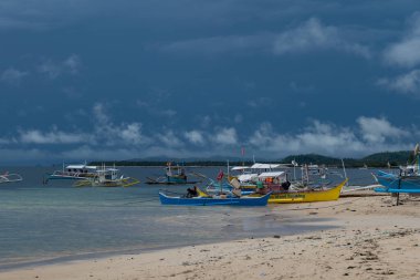 Catamarans on the beach in Siargao Island, Philippines, cloudy day
