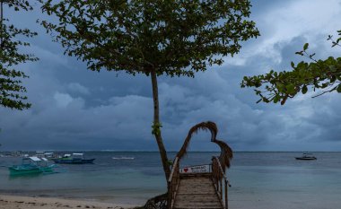Catamarans on the beach in Siargao Island, Philippines, cloudy day