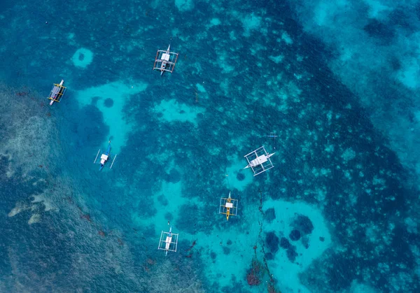 aerial view, Beach coral reef and catamarans on Siargao island, Philippines, seen from above, drone photo