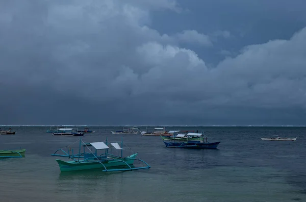 Catamarans on the beach in Siargao Island, Philippines, cloudy day