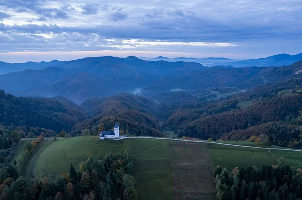 The Church of St. Primo and Felicijan, Jamnik, Slovenia, sunset drone photo