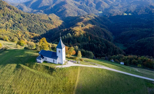 The Church of St. Primo and Felicijan, Jamnik, Slovenia, sunset drone photo