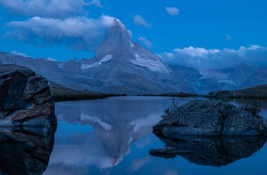Matterhorn peak seen after sunset over Lake Stellisee, night shots, Zermatt, Switzerland