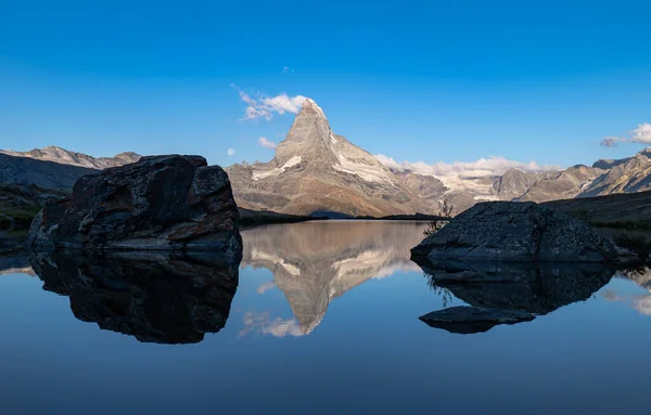 Matterhorn peak as seen from Lake Stellisee before sunset, Zermatt, Switzerland