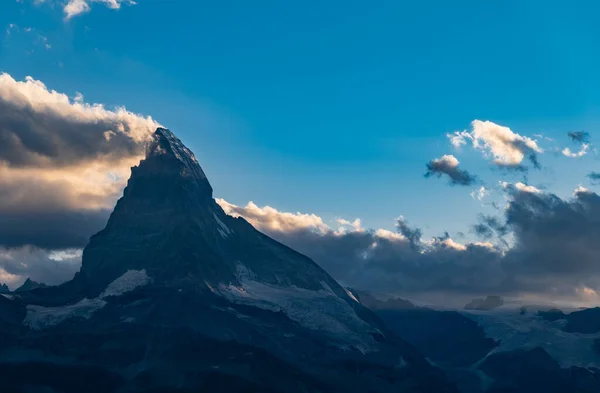 Matterhorn peak as seen from Lake Stellisee before sunset, Zermatt, Switzerland