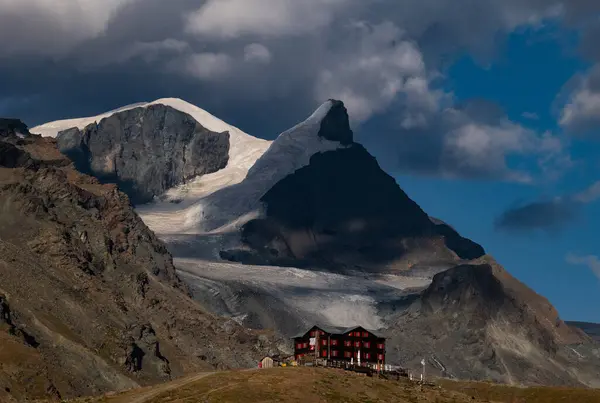  Fluhalp mountain hut in the Swiss Alps at sunset,  view of outdoor scene