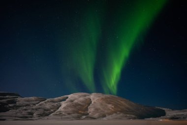 Aurora borealis on Norwegian fjords, Tromso, Norway