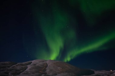 Aurora borealis on Norwegian fjords, Tromso, Norway