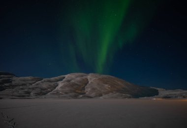 Aurora borealis on Norwegian fjords, Tromso, Norway