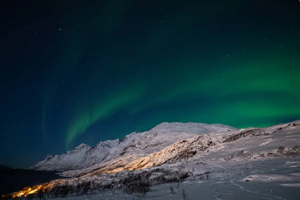Aurora borealis on Norwegian fjords, Tromso, Norway