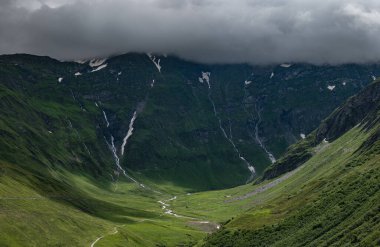 beautiful mountain landscape with a cloudy blue sky background, Switzerland