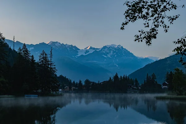 Champex Lac. Switzerland. beautiful landscape of lake with trees and clouds