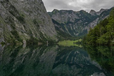 beautiful landscape of the lake in the mountains, Obersee lake, German Alps, reflections in water