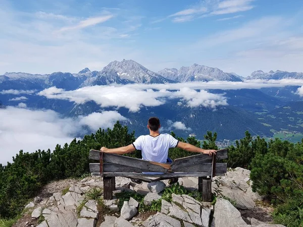man sitting on the bench wondering mountains view, German Alps,Berchtesgaden
