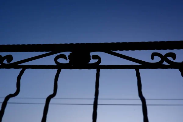 Silhouette Fence Photographed Blue Sky Background — Stock Photo, Image