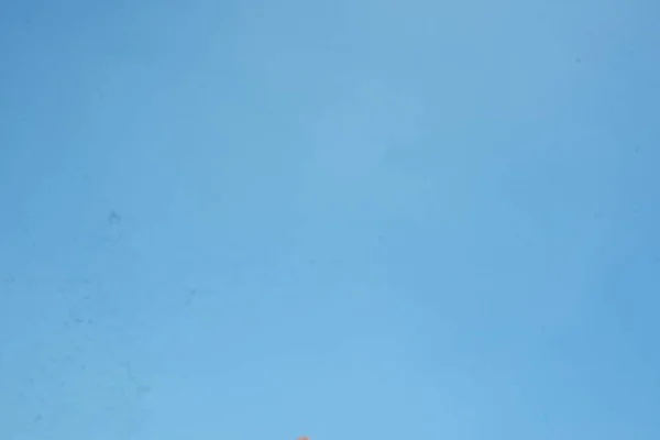 Background blue sky with clouds in summer. hot sunny day sky in indonesia