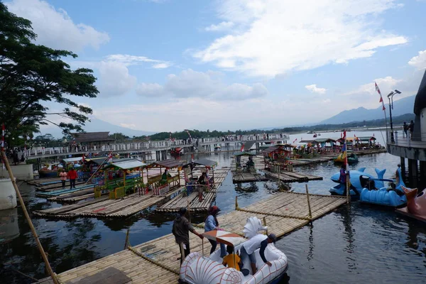Bagendit Lake tourist attractions with a bamboo boat to play in the middle of the lake.