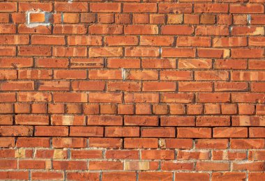 An old brick wall to be used as a background or texture.