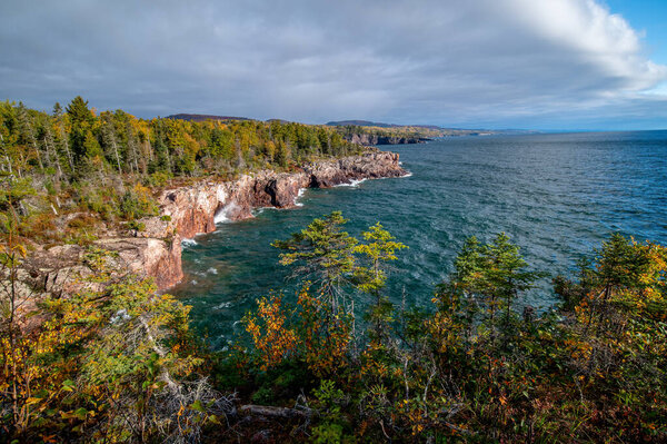 The rugged and wild shoreline of the North Shore of Lake Superior on an overcast autumn day.