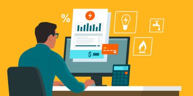 Evdeki faturaları internetten kontrol eden ve ödeyen bir adam.